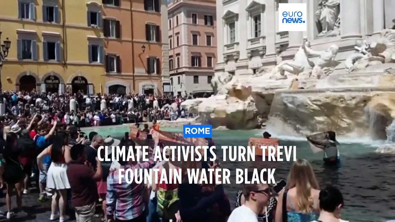 Climate activists turn the waters of Rome's Trevi fountain black