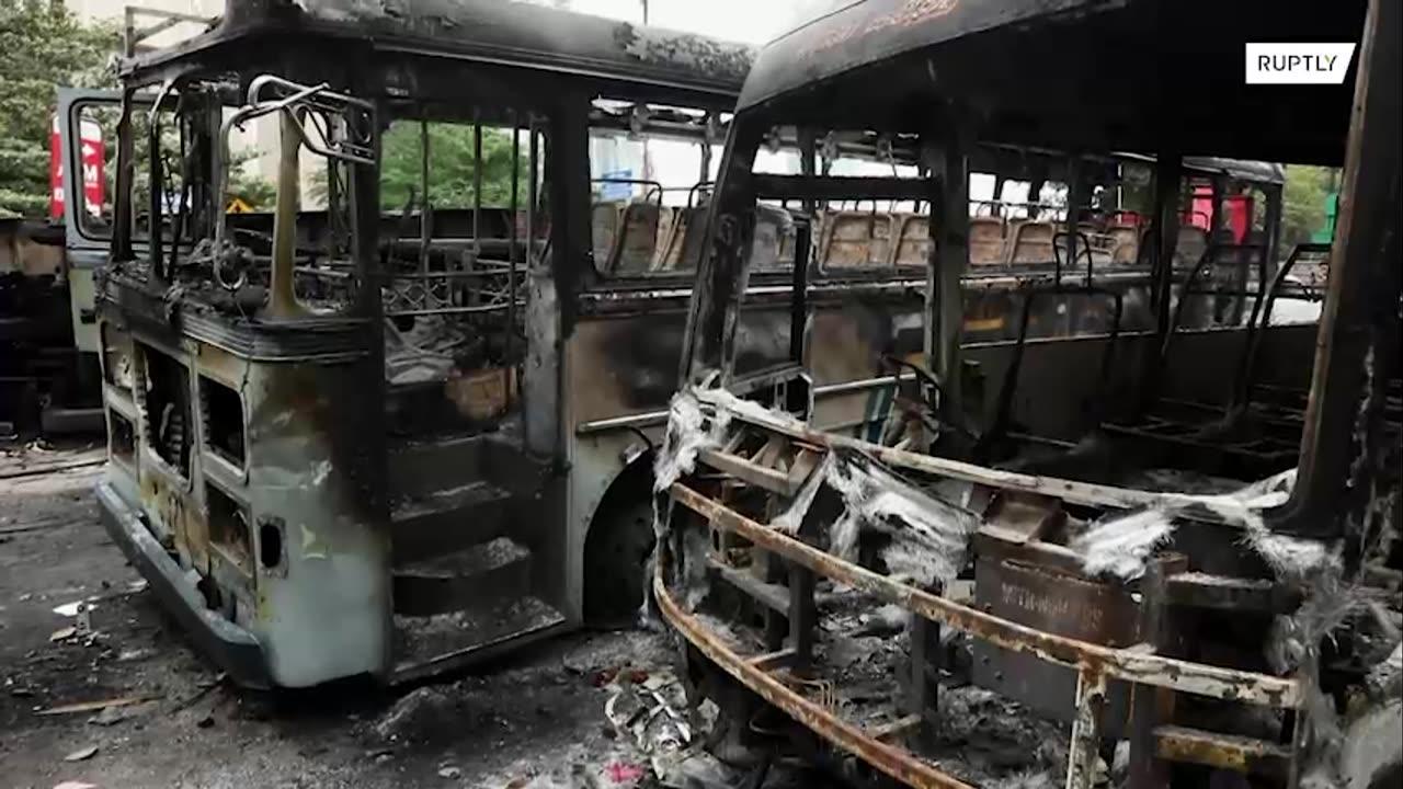 Destroyed vehicles thrown in water in aftermath of violent protests in Sri Lanka