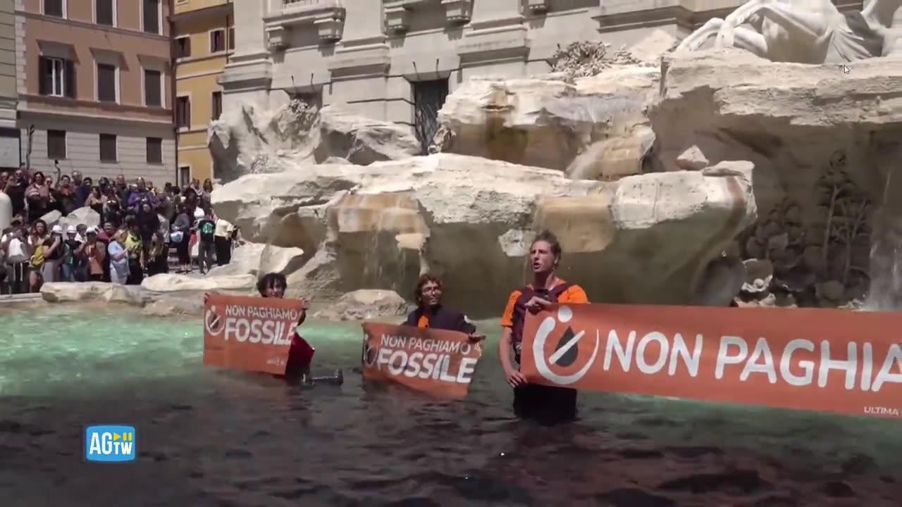 Radical climate change activists defile Trevi Fountain in Rome with black dye