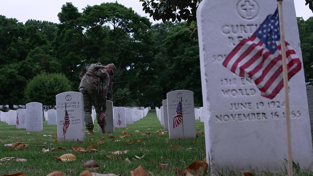 More than 1,000 servicemen place Americans flags in Arlington National Cemetery