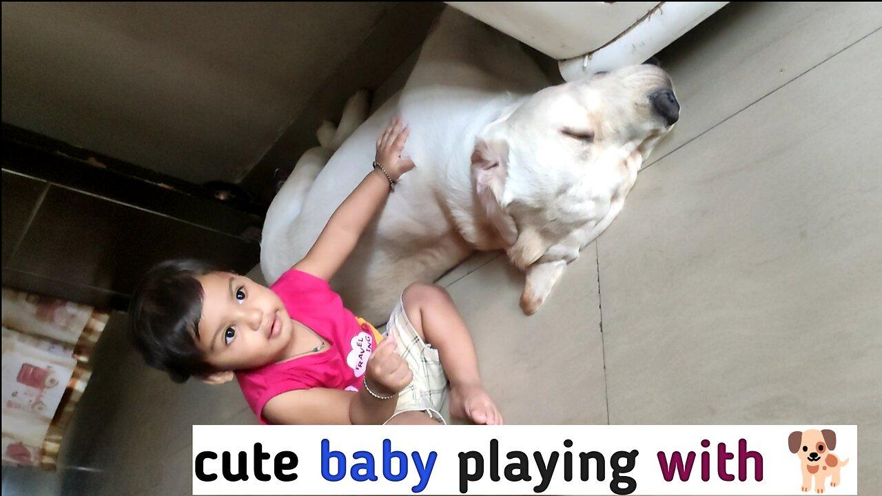 Cute baby playing with pet 🐕
