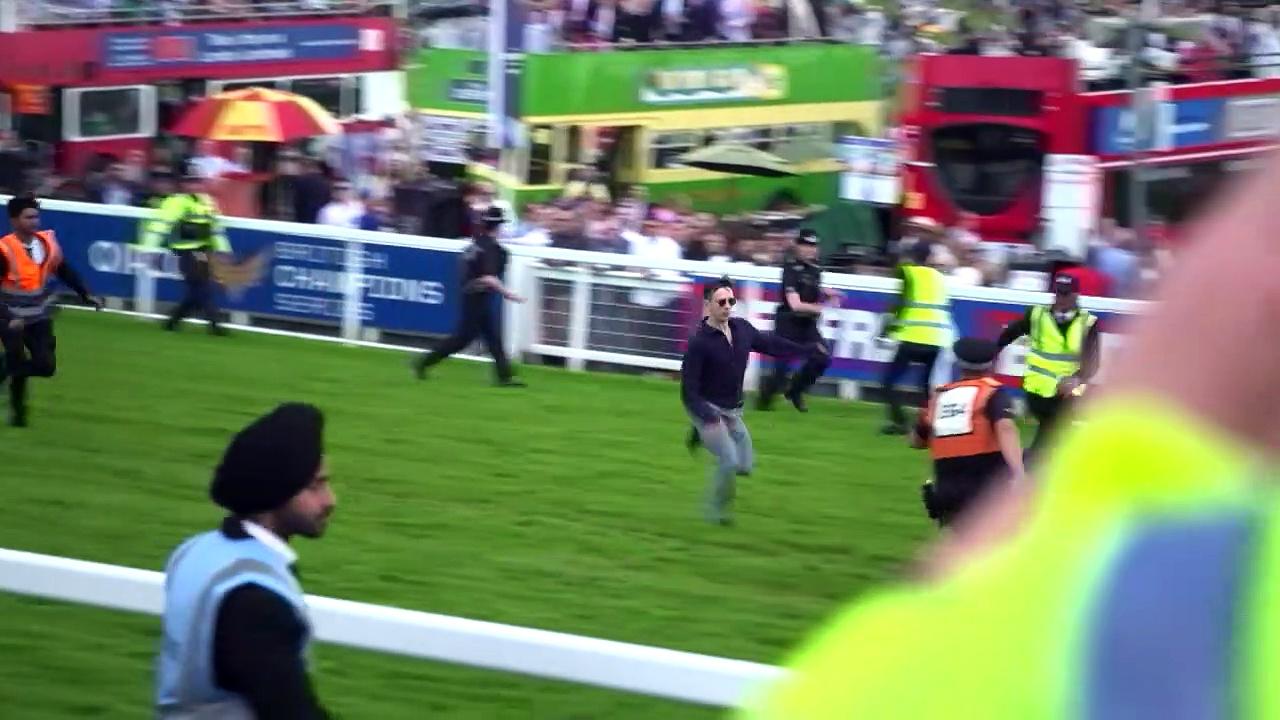 Protester tackled as he storms Epsom Derby racecourse