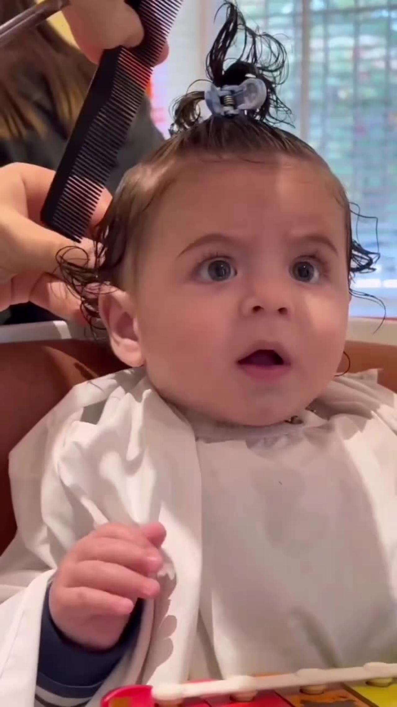 Cute baby first hair cut