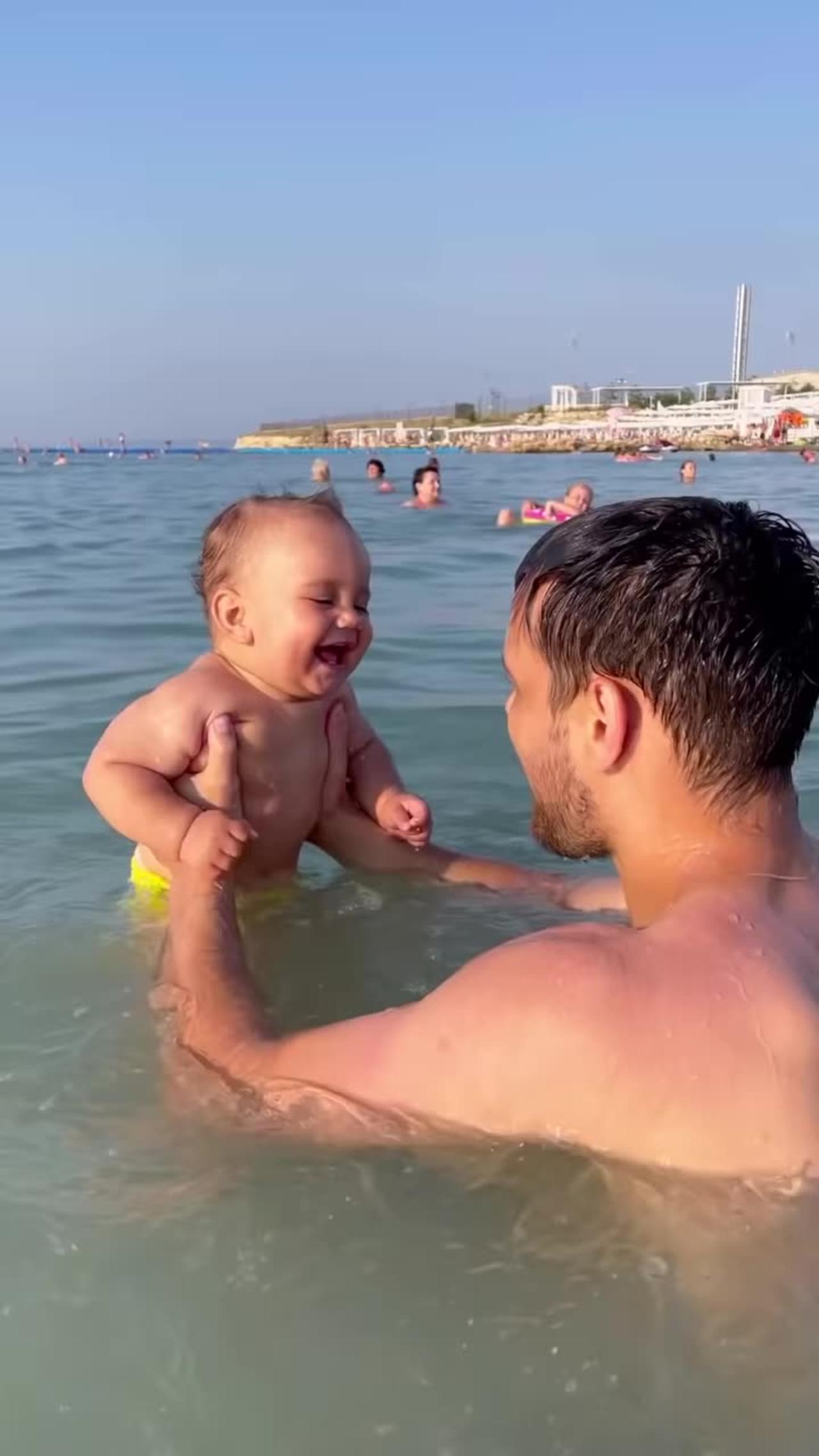 Beachgoing Baby Belly Laughing