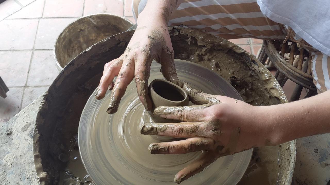 volunteer learning pottery