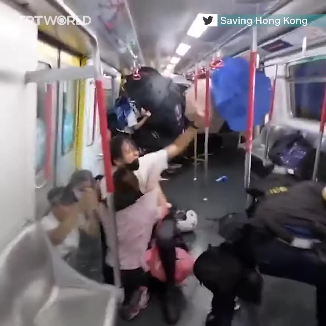 Police in Hong Kong beat up protesters on train