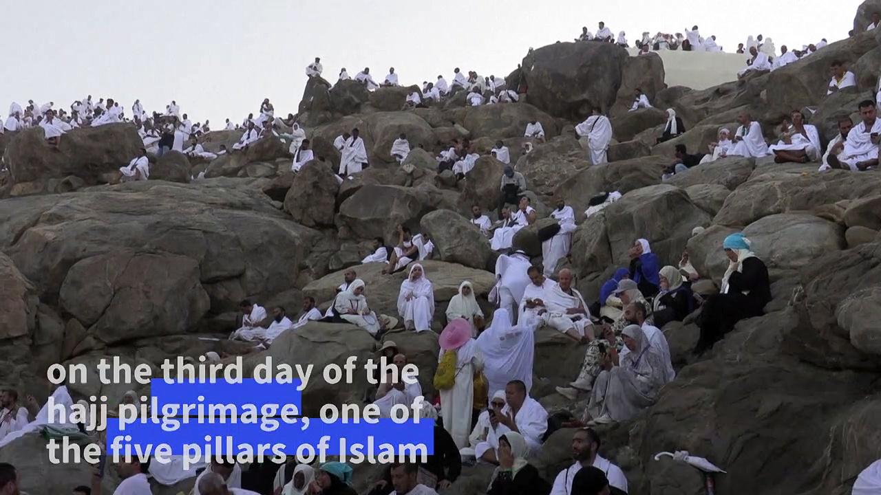 Muslim pilgrims climb Mount Arafat at height of the hajj