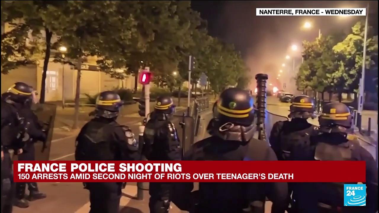 France unrest: Riots spread, police officer charged with shooting teenager dead