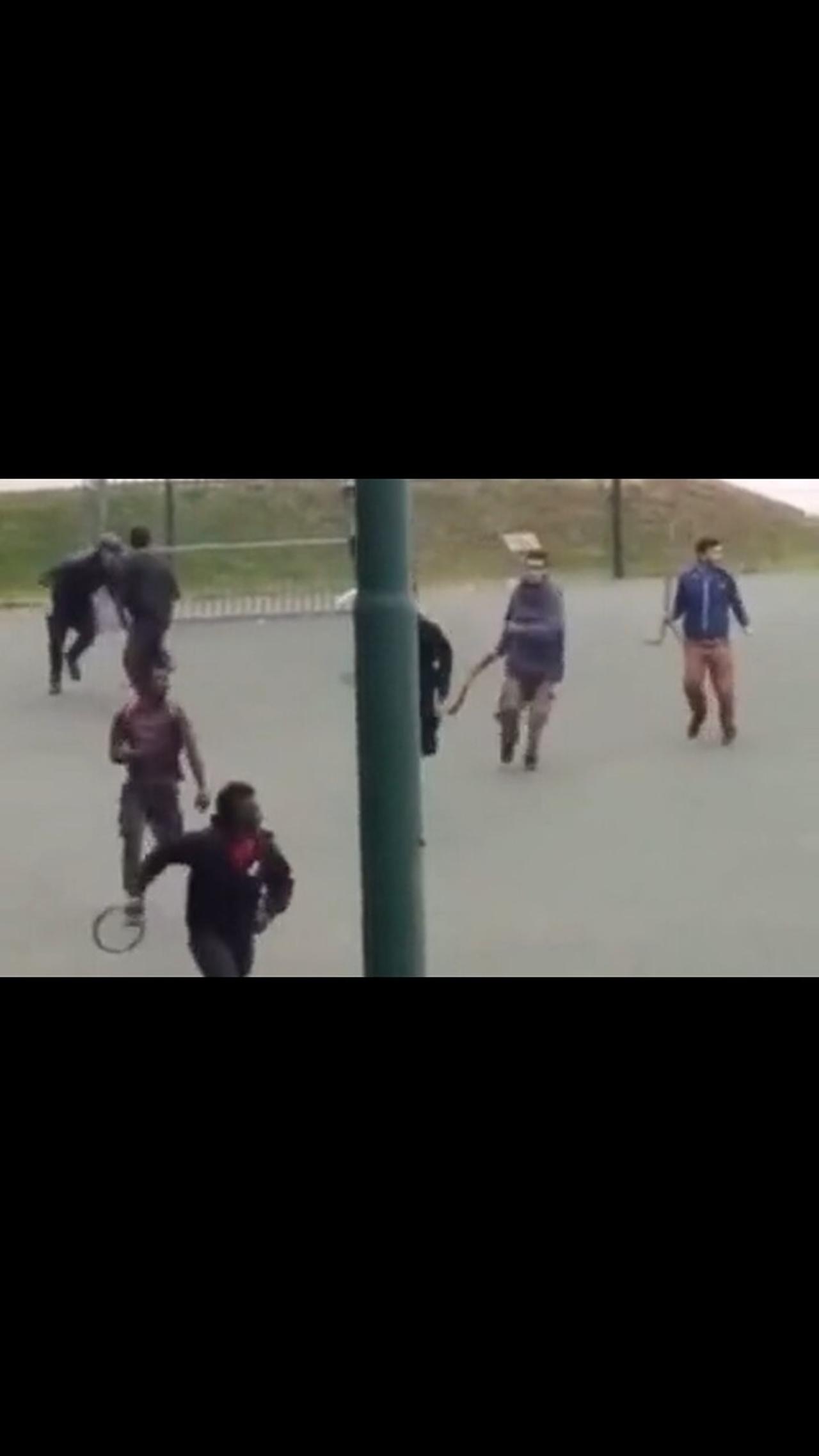 Afghans & Africans trying to murder each other with machetes & sticks at a park in Italy
