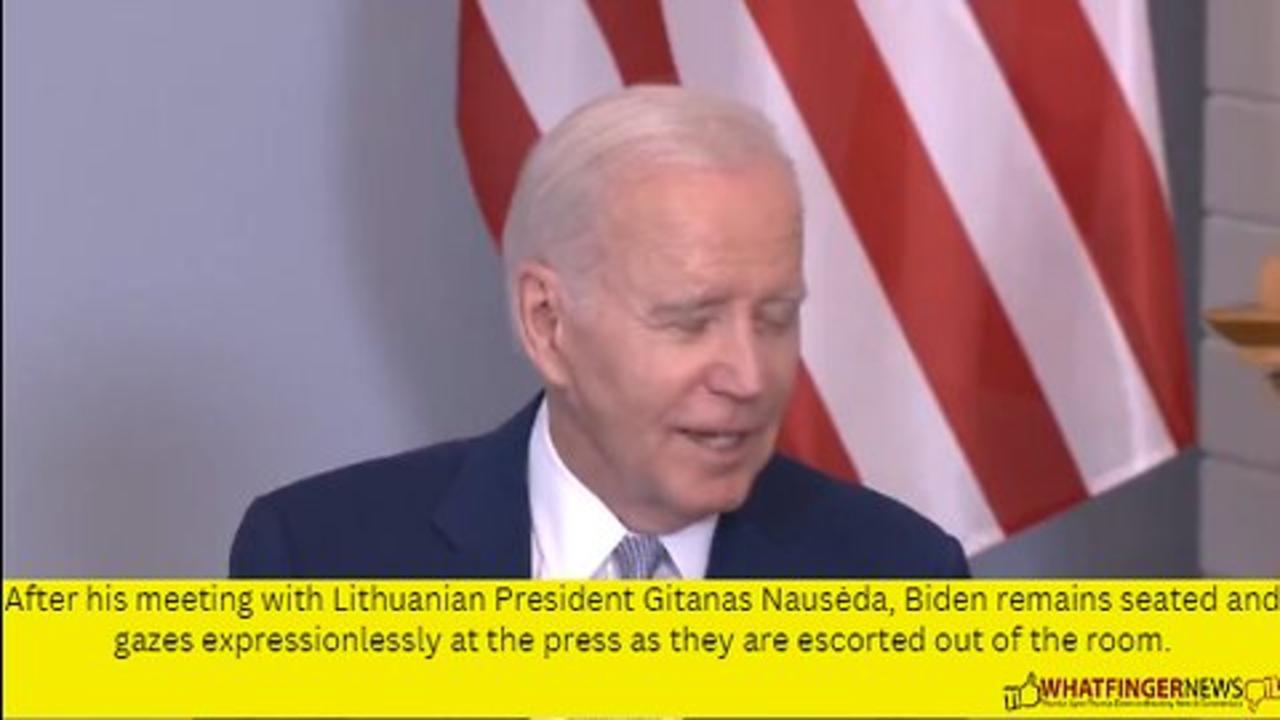 After his meeting with Lithuanian President Gitanas Nausėda, Biden remains seated
