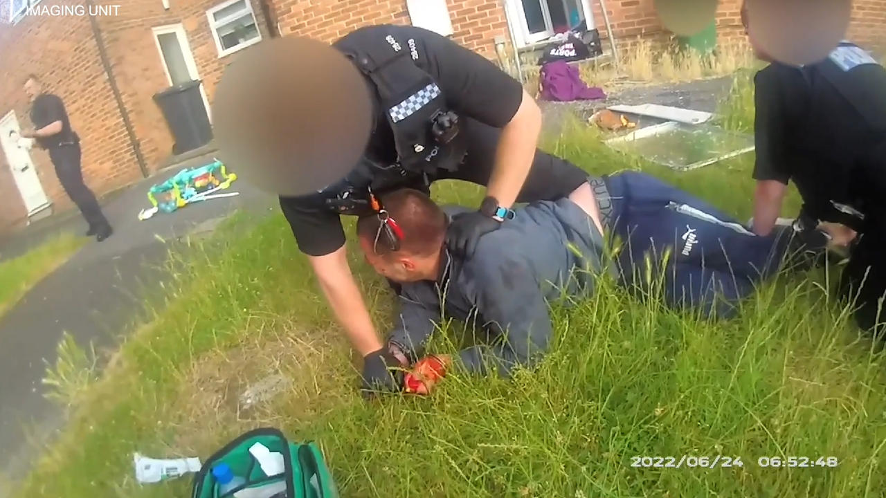 Police bodycam shows bloodied man being dragged from house after threatening ex-partner and slashing officer