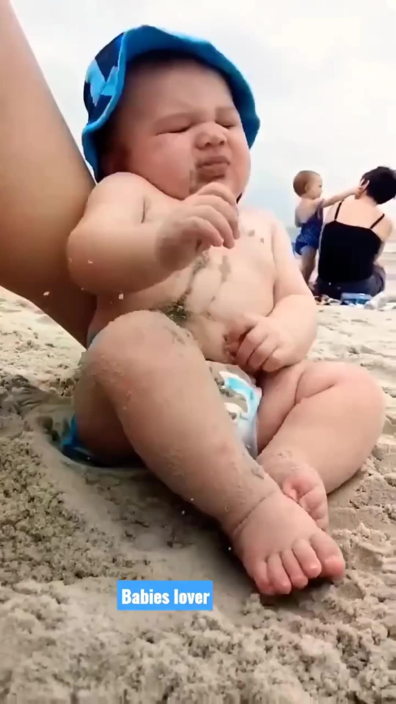Funny baby reaction to the beach