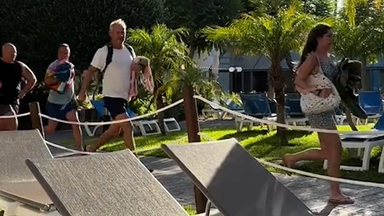 Holidaymakers armed with beach towels filmed sprinting to get a sunbed