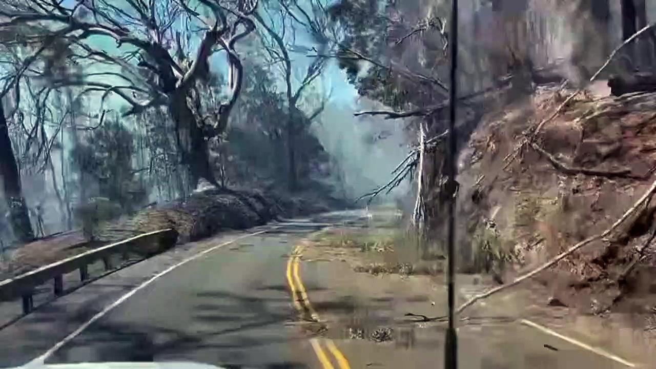 Smoke from Hawaii wildfires engulfs road in Maui County