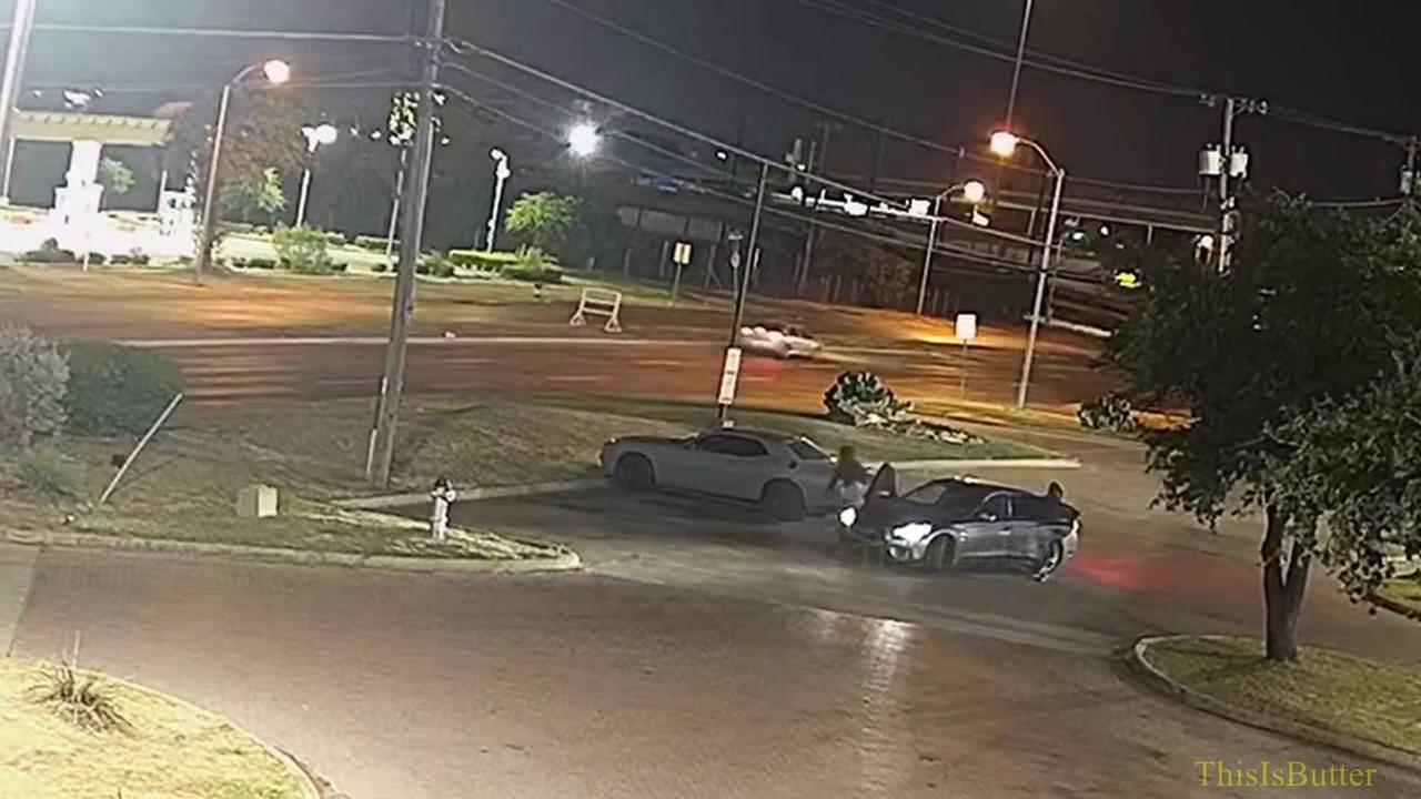Surveillance video shows Dallas police officer getting in a shootout with carjackers