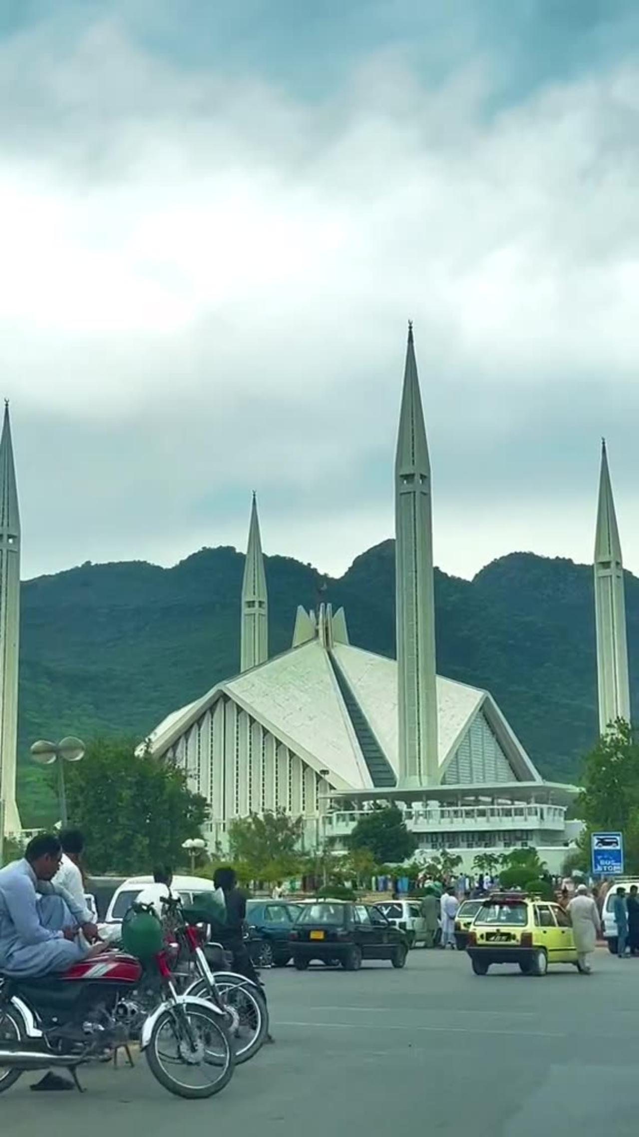 "Harmony in Stone and Nature: Faisal Mosque Framed by Breathtaking Hills"