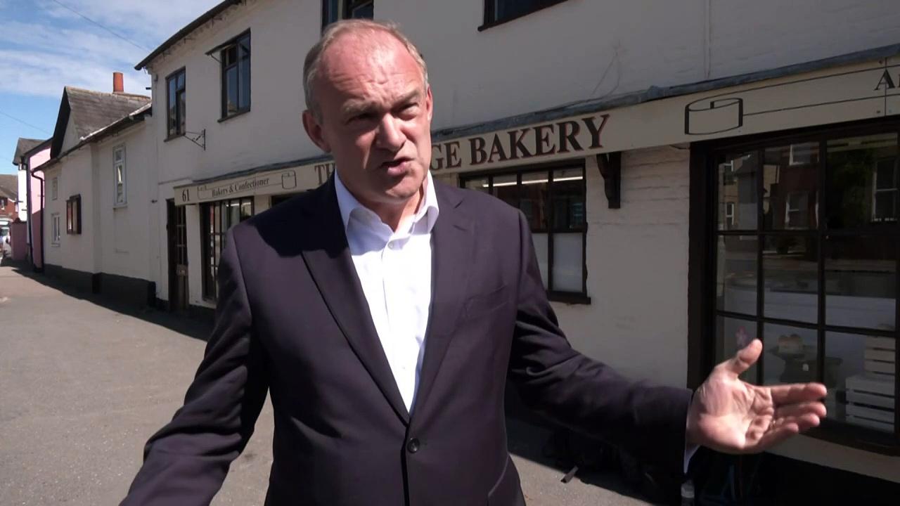 Ed Davey tucks into sweet treat on trip to local business