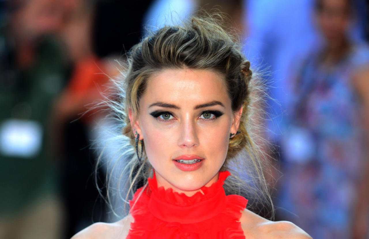 Amber Heard won't be prosecuted over the illegal importation of her dogs into Australia eight years ago