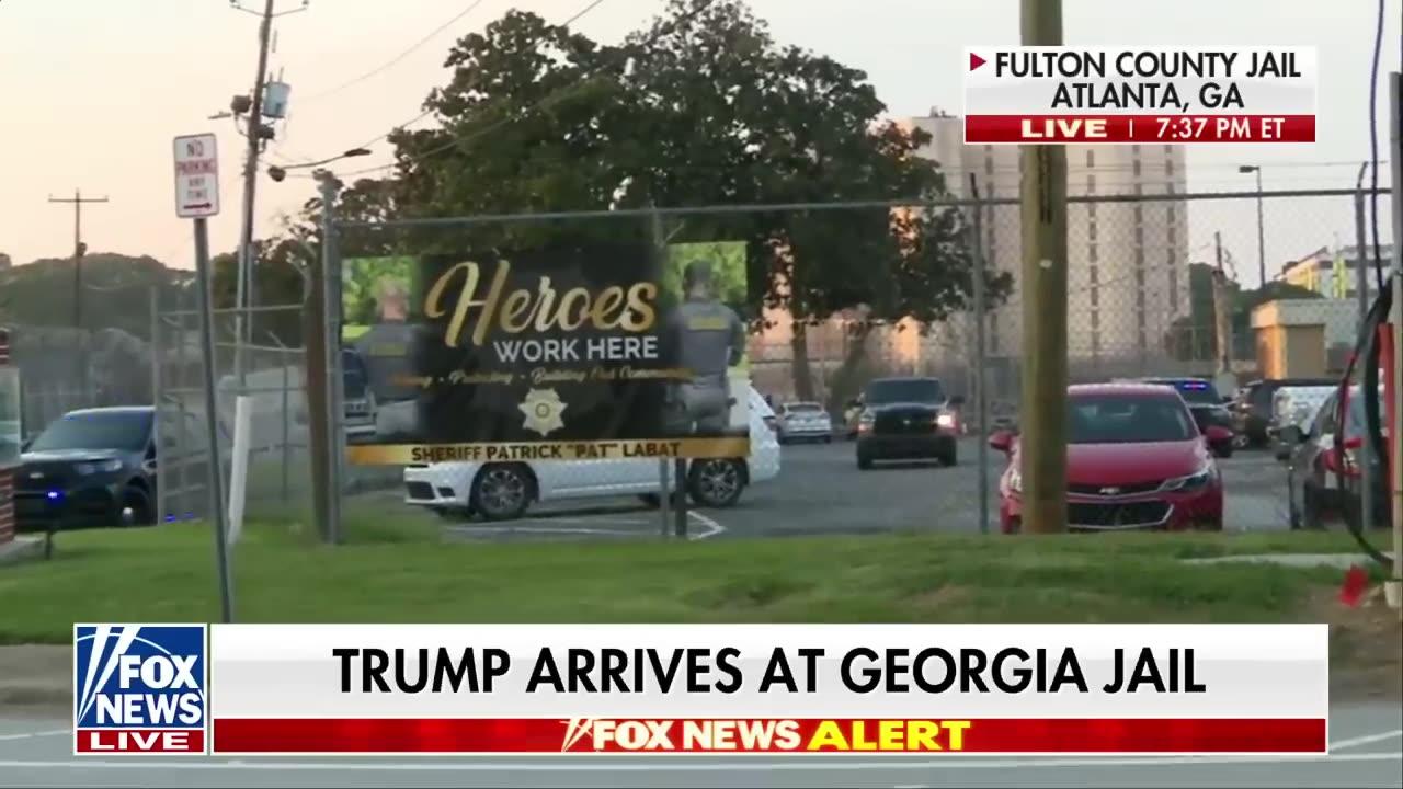 Trump turns himself in at Georgia jail.
