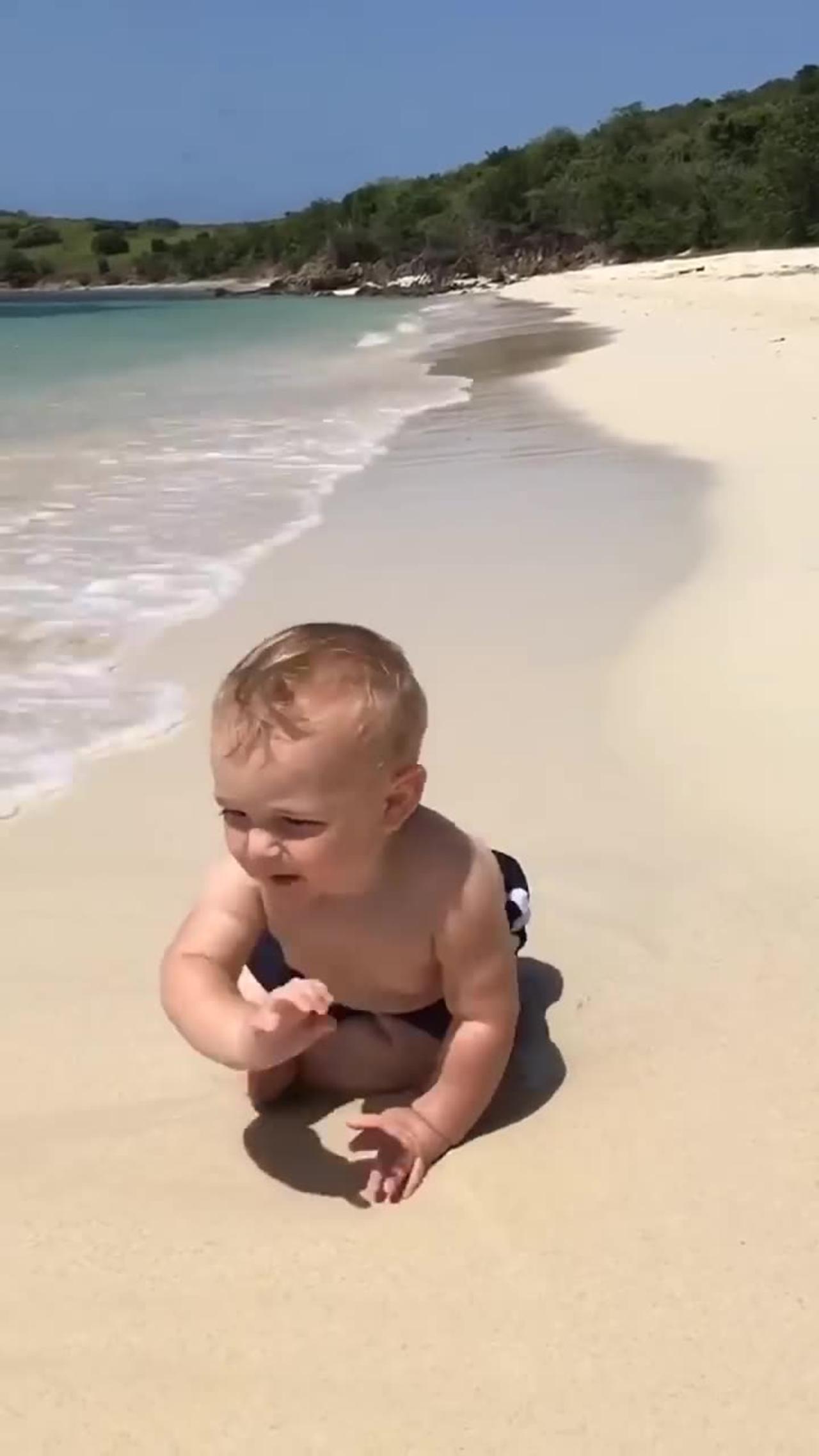 Funny baby reaction on beach ⛱️