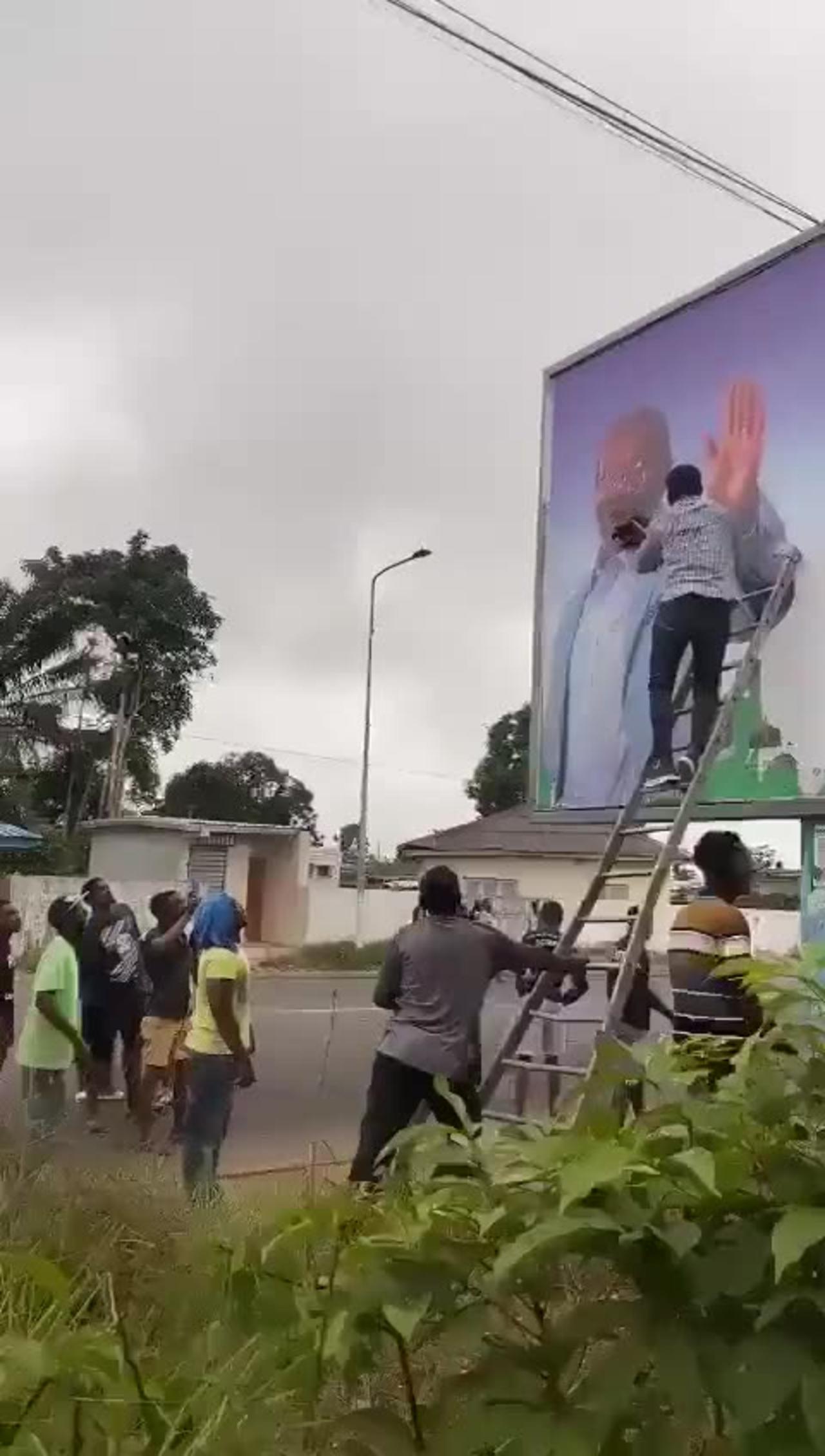 Billboard of the Gabon President being smeared by the people after the military coup