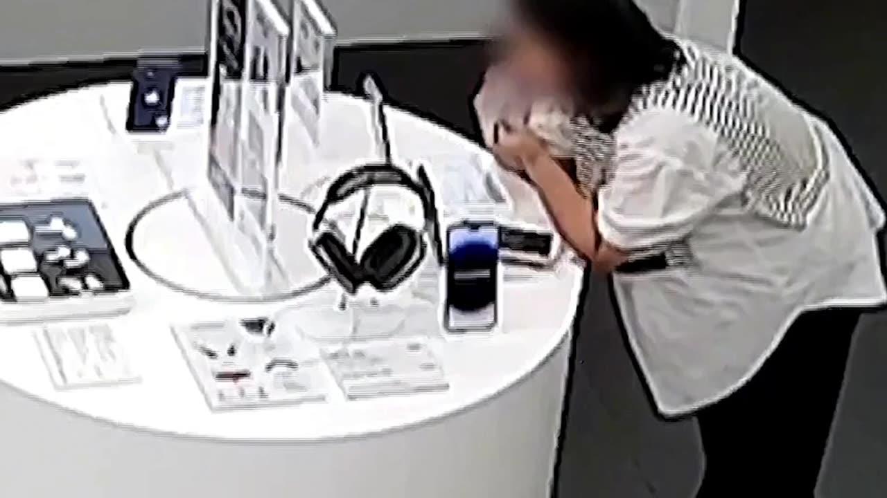 Woman steals iPhone by biting through security cable