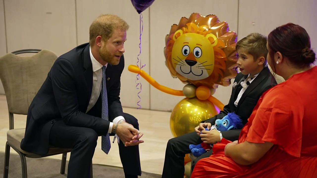 Prince Harry says the late Queen 'is looking down on us all’