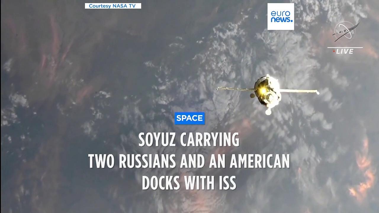 An astronaut and two cosmonauts arrive at the International Space Station