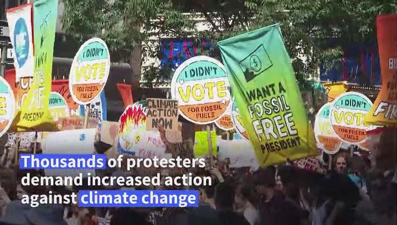 Climate protesters throng New York, demand end to fossil fuels