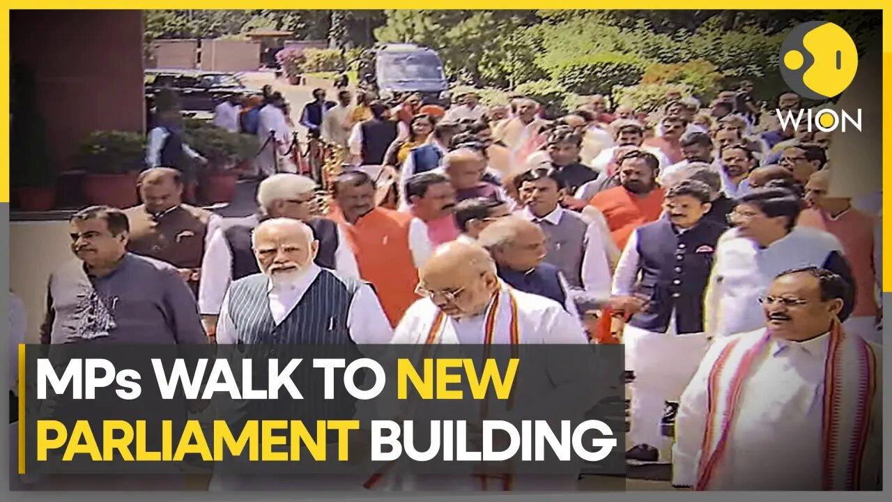 Indian lawmakers walk to the new Parliament Building carrying a copy of the Constitution | WION