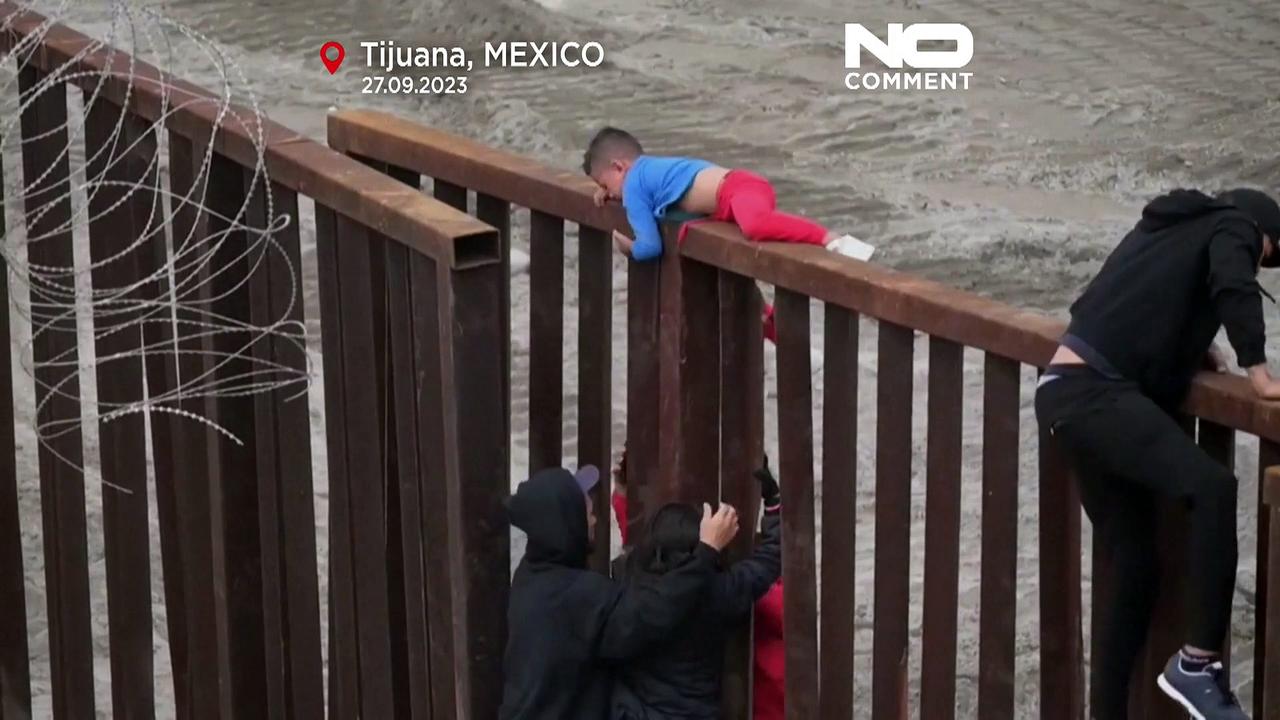 WATCH: Dozens of migrants attempt to reach US climbing Tijuana border fence