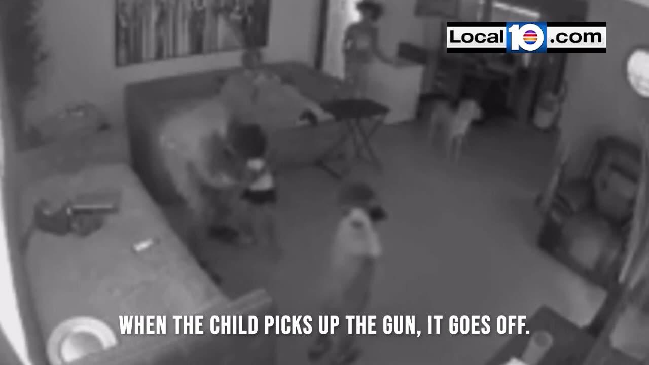3-year-old grabs a loaded gun on a couch while the owner watches football on his laptop