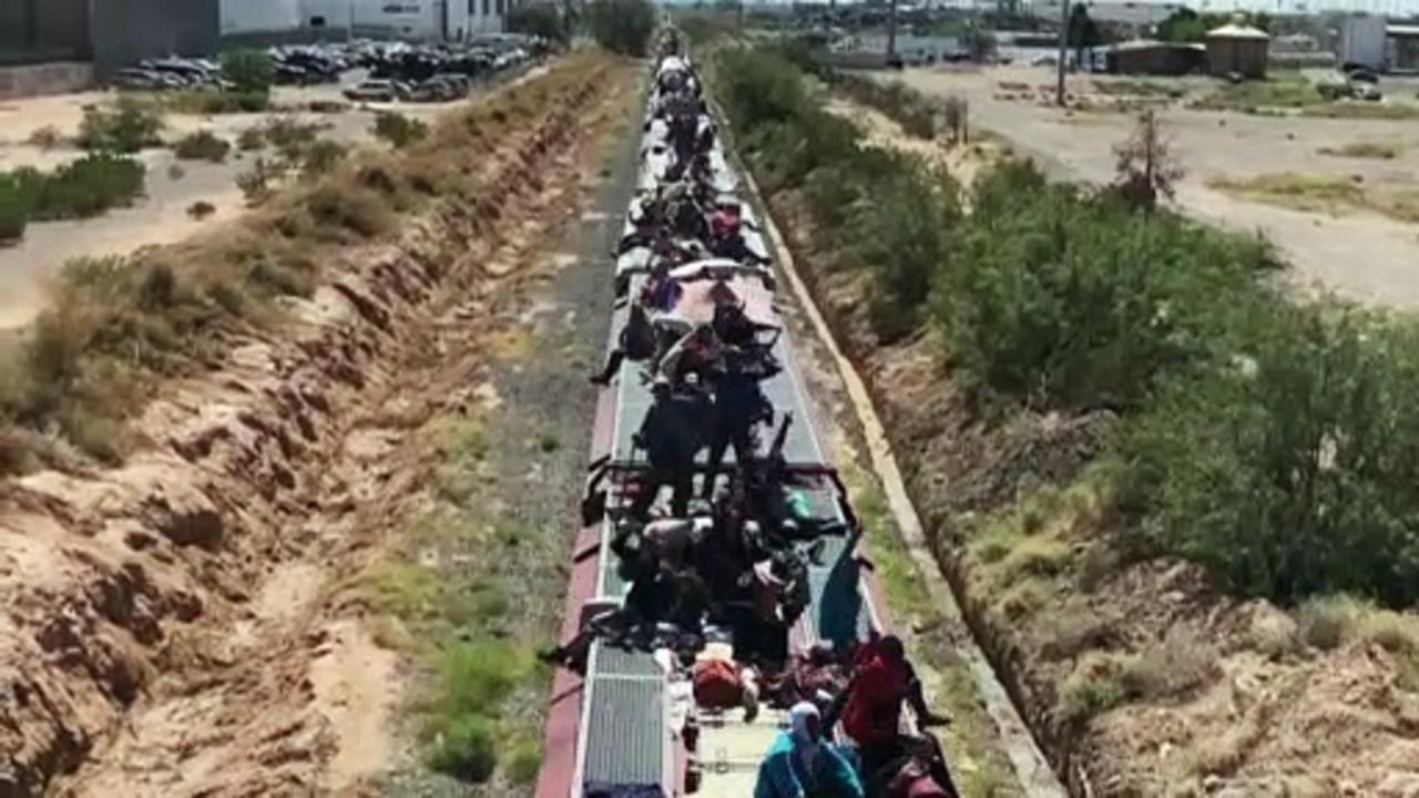 WATCH: Migrants arrive at Mexico-US border after days travelling aboard cargo train