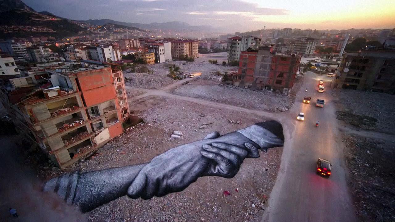French artist Saype paints mural on Turkey earthquake rubble