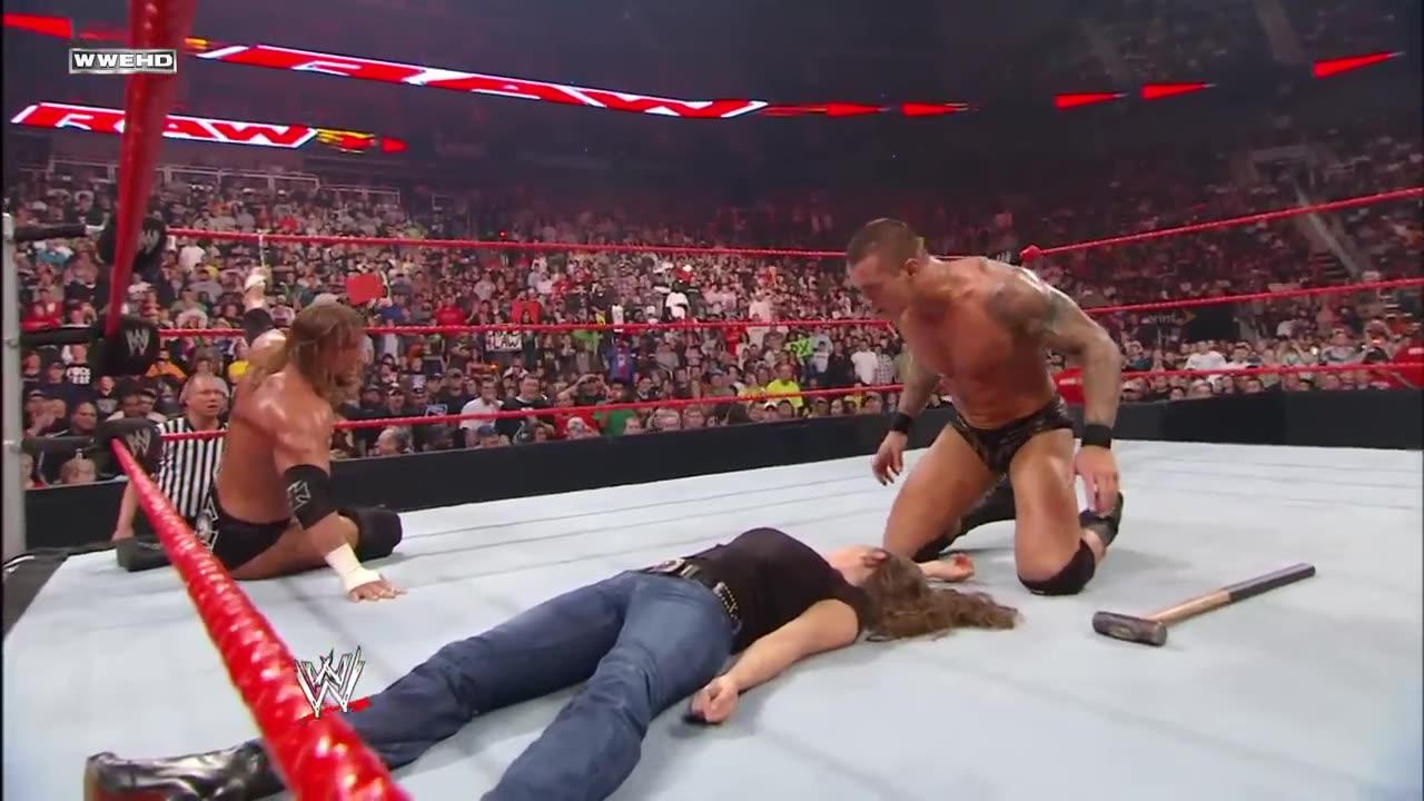 Randy Orton kisses an unconscious Stephanie McMahon in front of Triple H