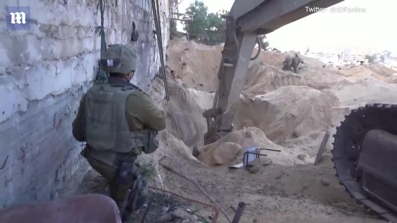 IDF blow up buildings and take out Hamas targets as troops surround Gaza with tanks and bulldozers