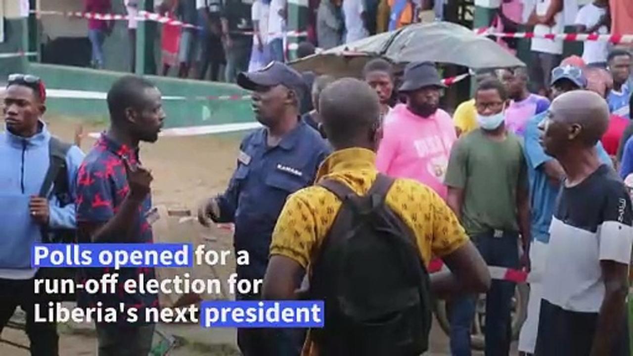 Liberians vote in presidential run-off between football legend and former Vice President