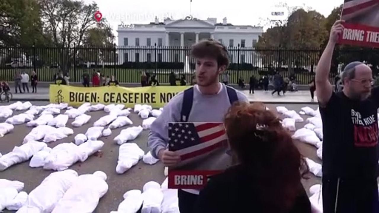 Watch: Amnesty International places mock body bags outside White House
