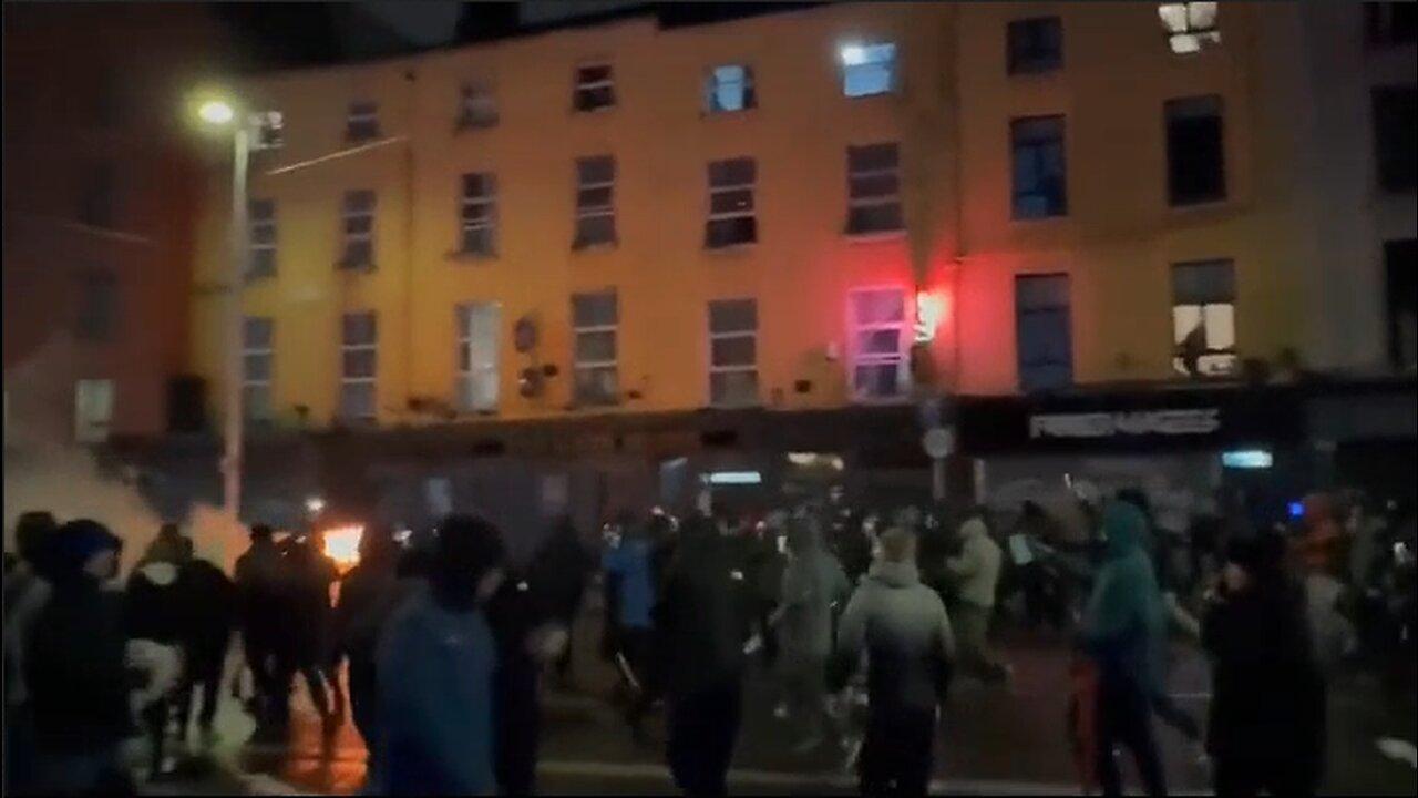 The Irish Burn Hotel Housing Invaders & Torch Police Cars In Dublin