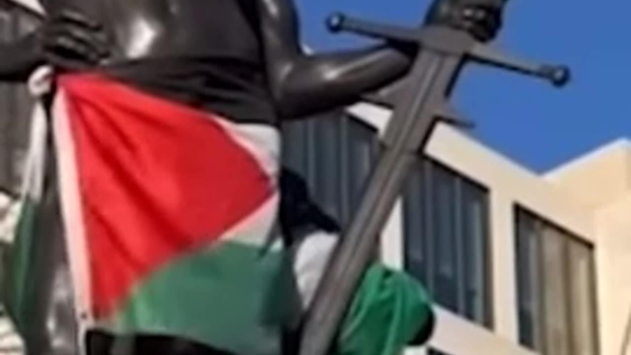 pro-Palestinian protesters climbing all over a war memorial during a demonstration this week.