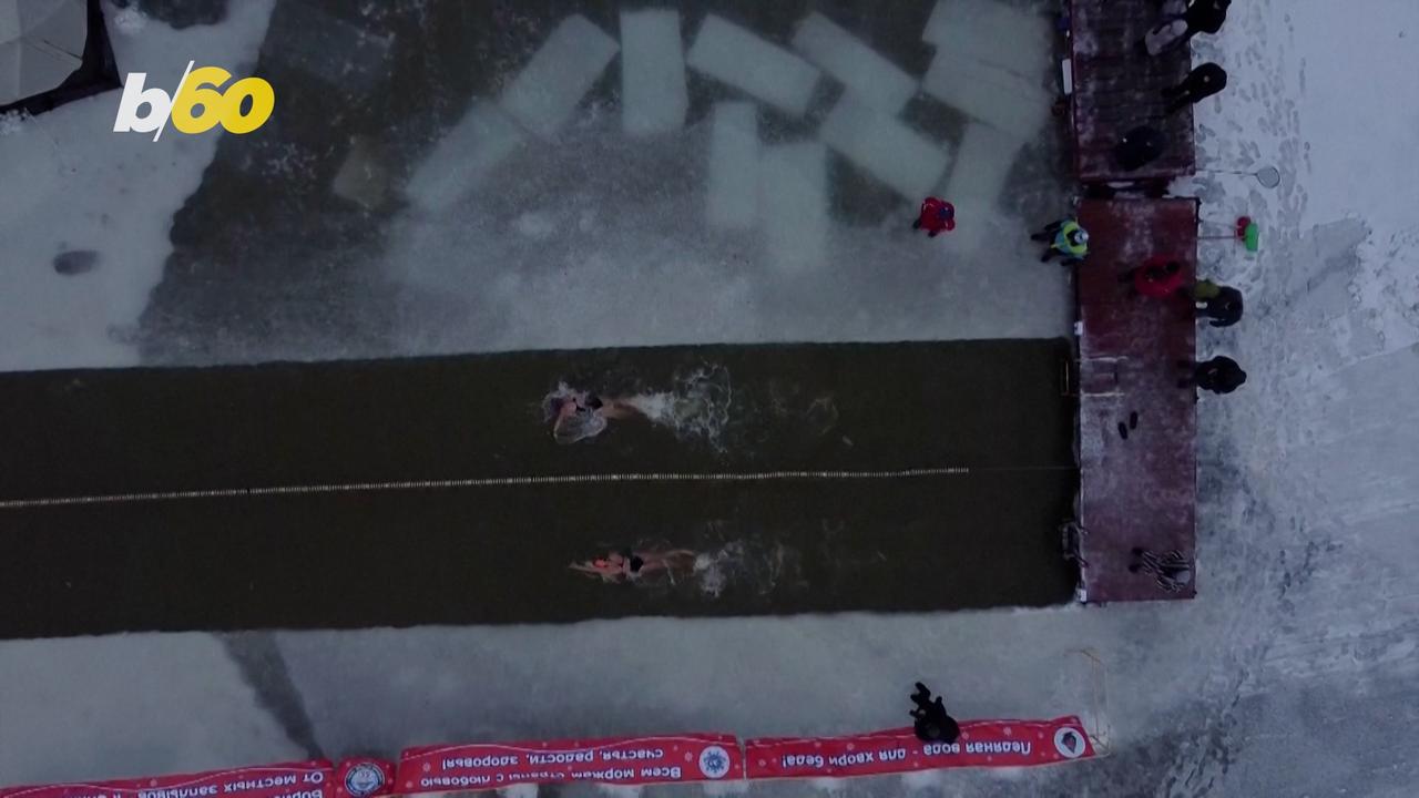Siberian Locals Welcome Winter by Swimming in Frozen Lake