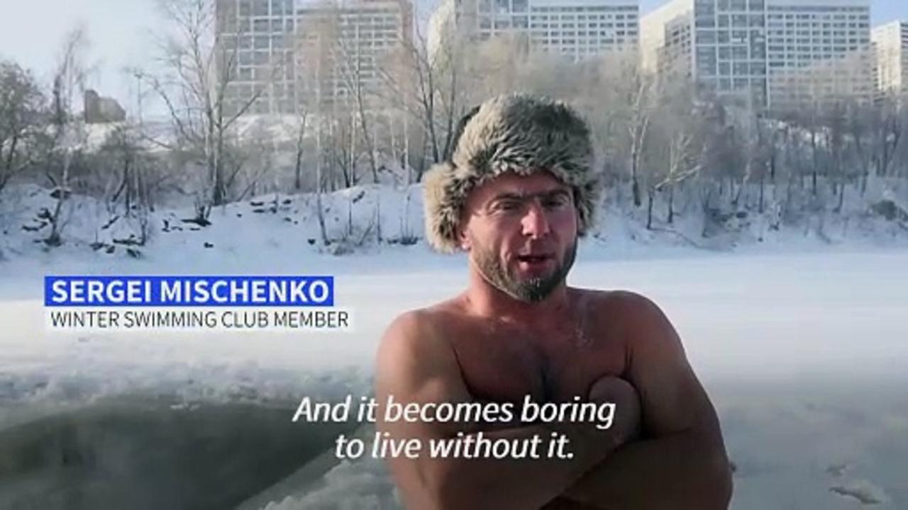 Siberian enthusiasts swim in frozen lake