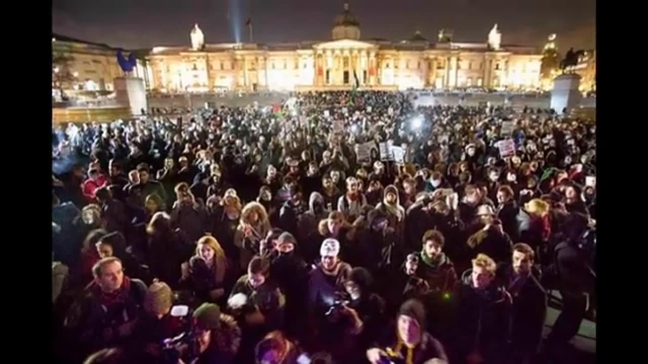 Russell Brand joins thousands of masked Anonymous protesters in outside Buckingham Palace London