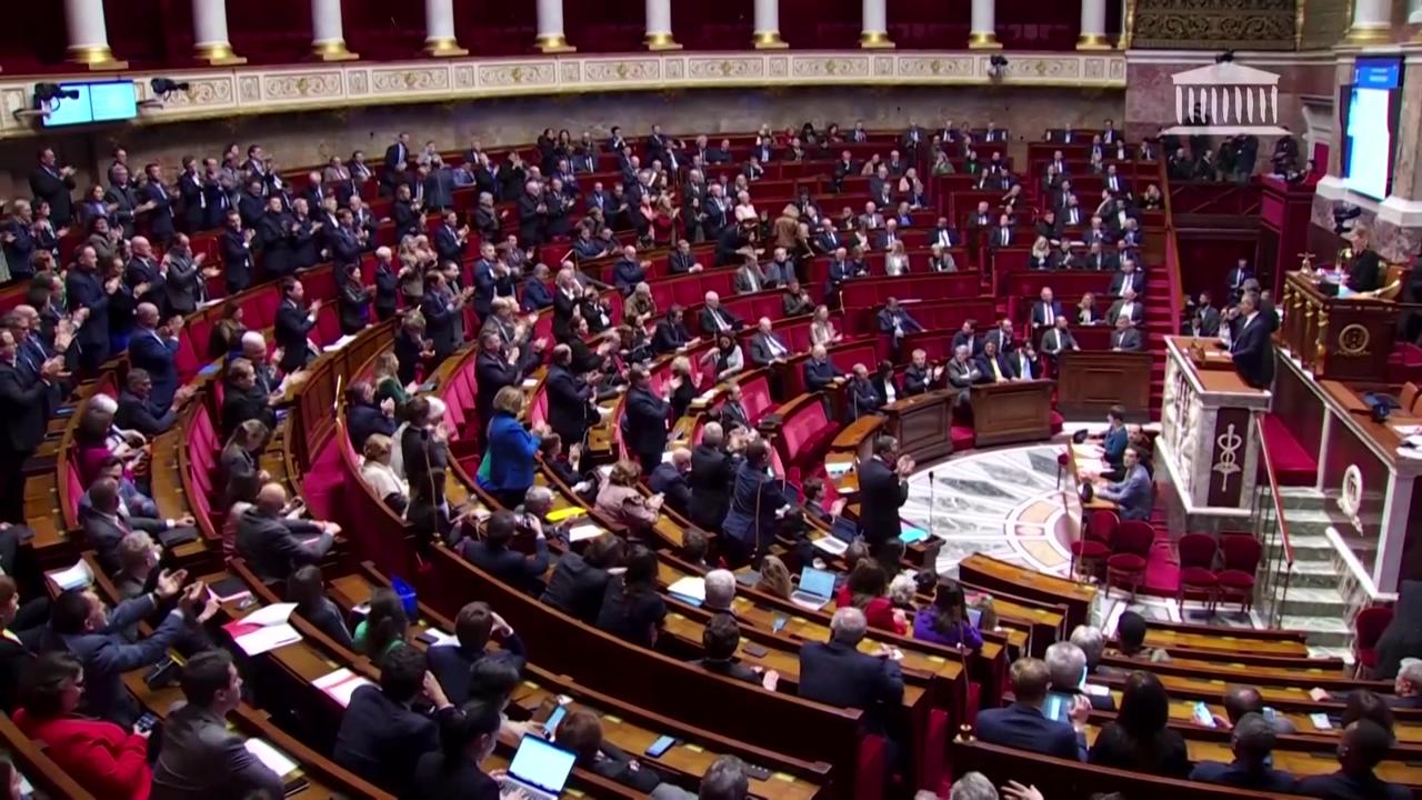 French lawmakers approve a tougher immigration bill
