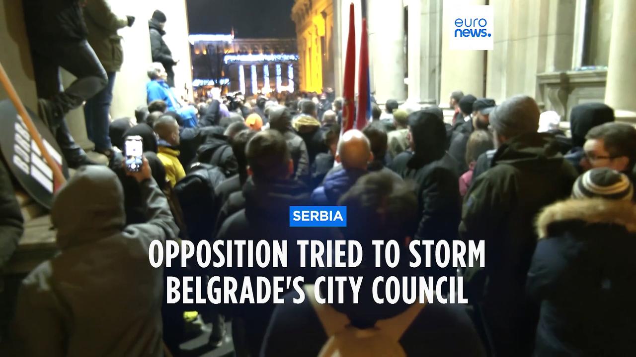 Serbian police fire tear gas at protesters threatening to storm city hall