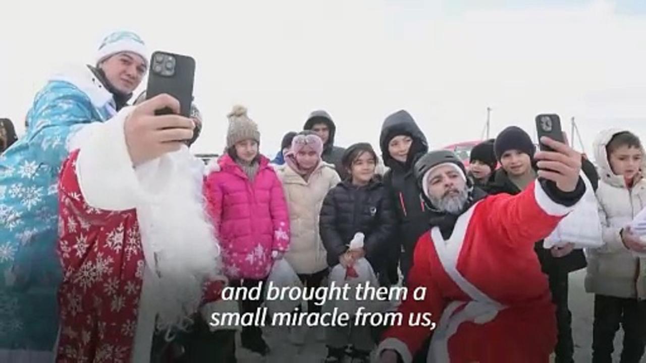 Armenian paragliding Santas bring gifts to Karabakh refugee kids