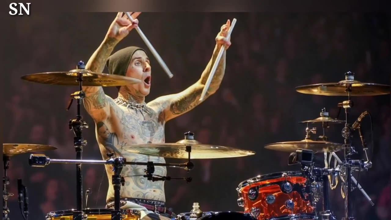 Travis Barker Gives Fan Drumsticks After Spotting Homemade Sign Outside of Concert