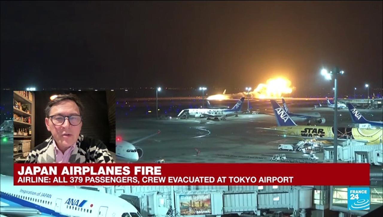 Passenger plane catches fire after a collision at Tokyo airport