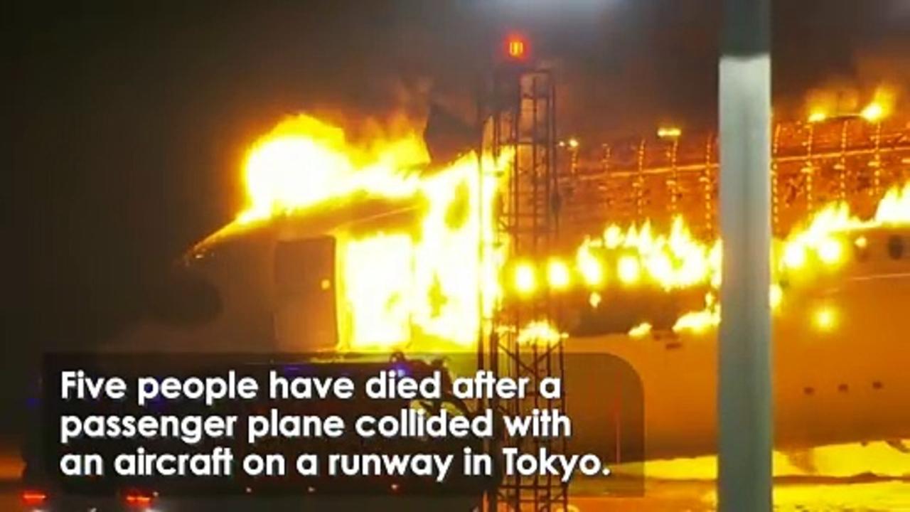 Horrifying moment plane bursts into flames on Tokyo runway