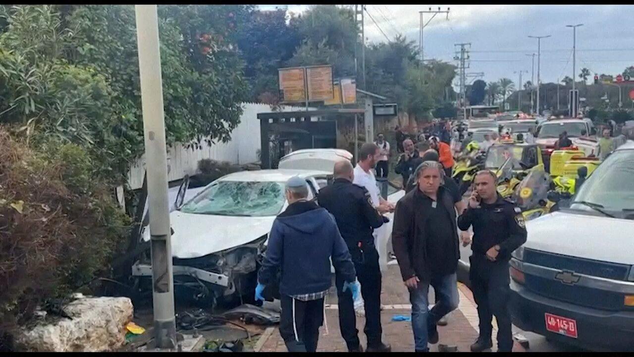 Israeli forces inspect damaged car following suspected attack in central Israel